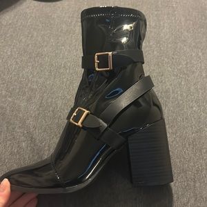 Bamboo. Shiny black buckle boot. Never worn. Size 8.5